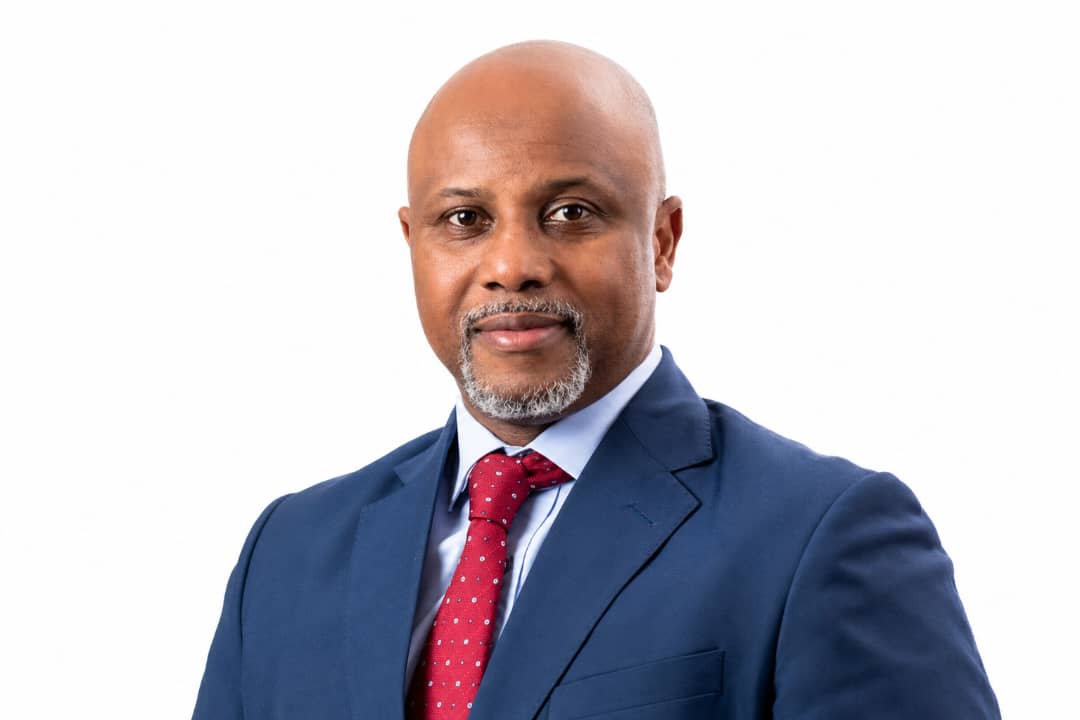 Formal white-background portrait of Lesego Osman